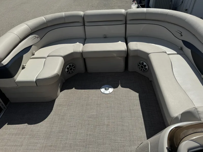 Slide: The Image of 2019 Bennington SX 21 SSRCX pontoon boat interior with plush seating and carpeted floor. - 8
