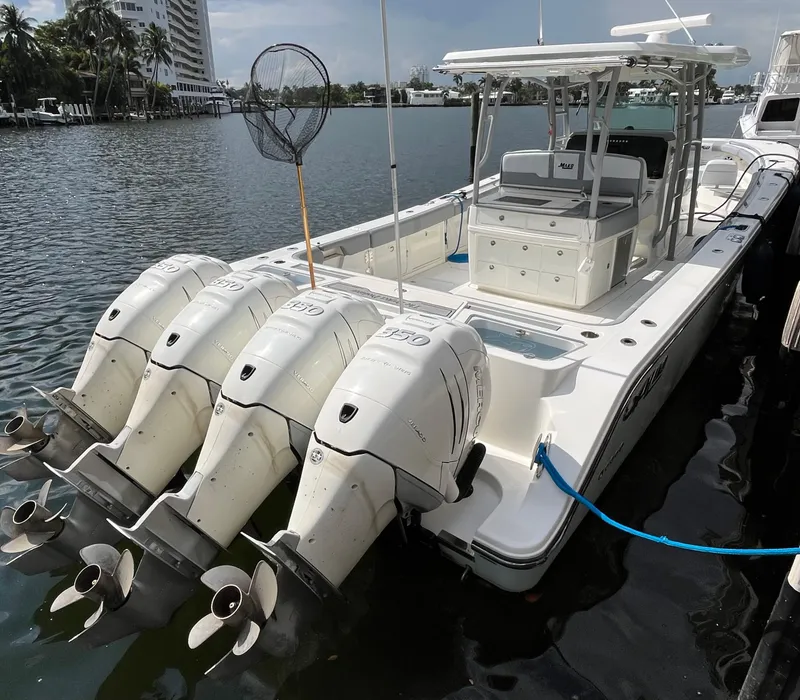 Slide: The Image of 2017 Mako 414 CC Bluewater Family Edition boat with four powerful outboard engines. - 2