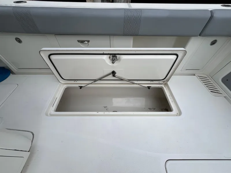 Slide: The Image of Open storage compartment on 2017 Mako 414 CC Bluewater Family Edition boat. - 20
