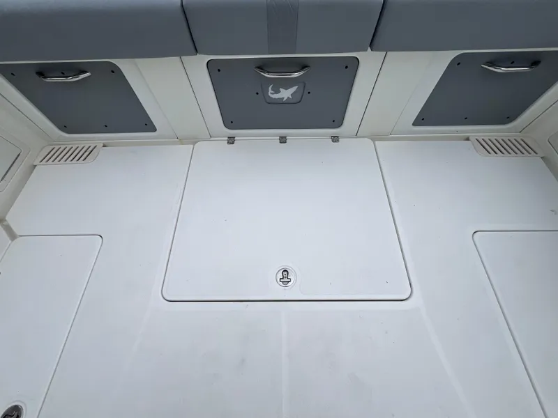 Slide: The Image of 2017 Mako 414 CC Bluewater Family Edition boat deck with storage compartments. - 21