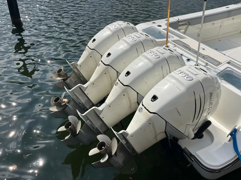 Slide: The Image of Four Mercury 350 outboard engines on a 2017 Mako 414 CC Bluewater boat. - 3