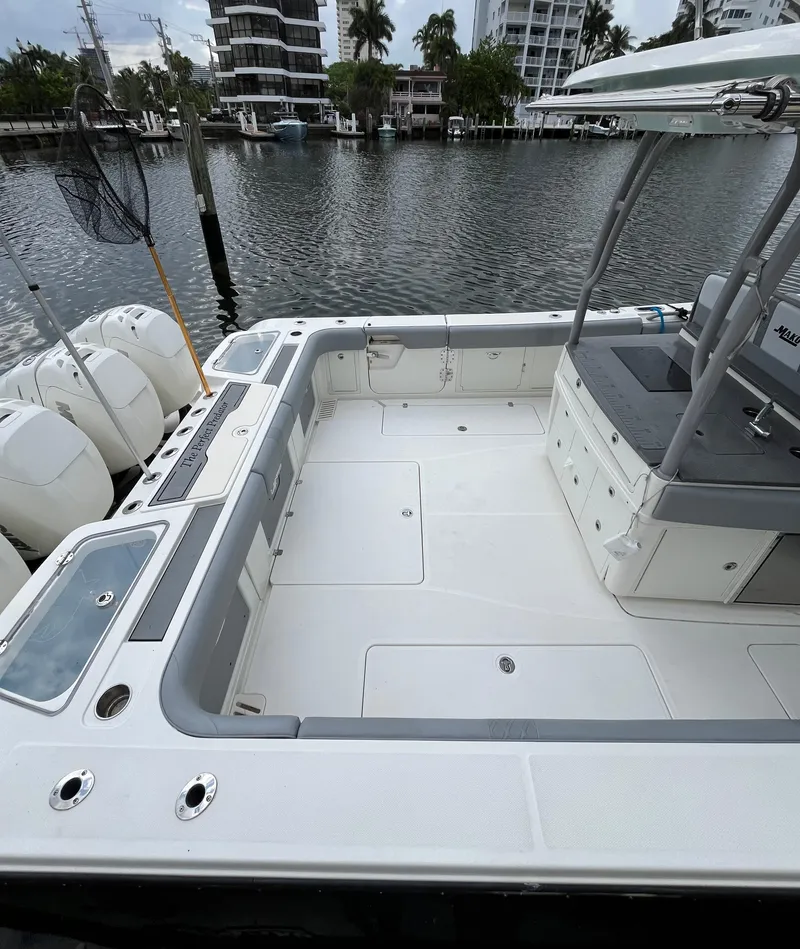 Slide: The Image of 2017 Mako 414 CC Bluewater Family Edition boat docked by waterfront. - 4