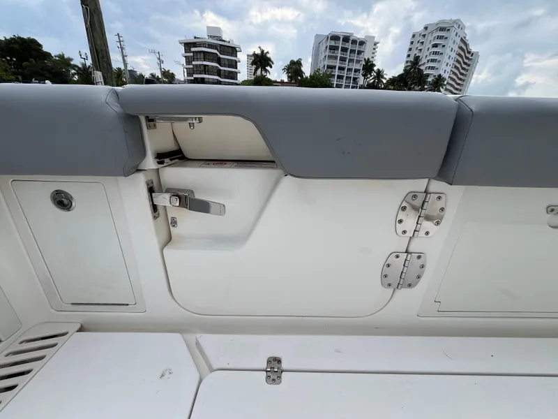 Slide: The Image of 2017 Mako 414 CC Bluewater boat interior with gray seating and storage compartments. - 41