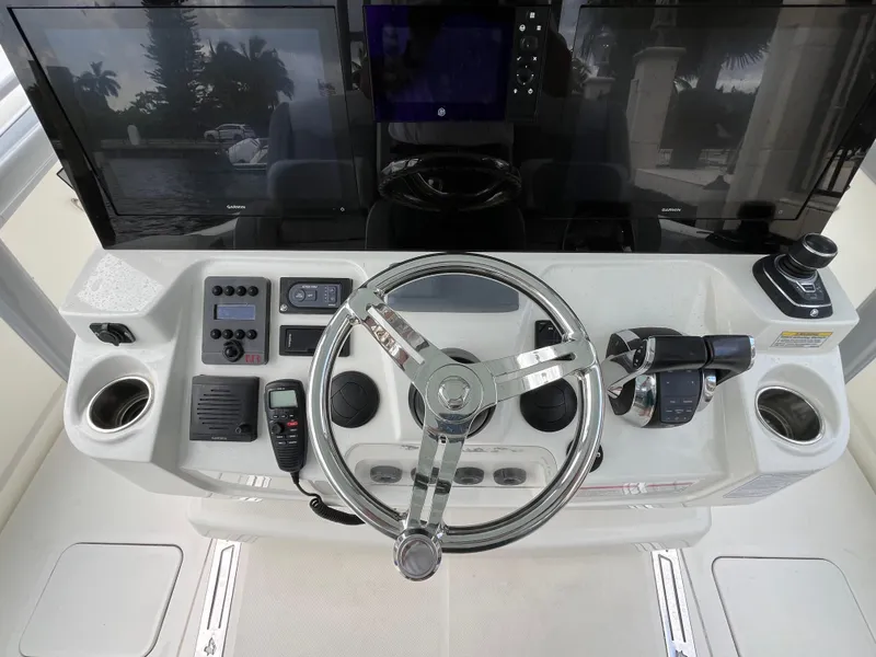 Slide: The Image of 2017 Mako 414 CC Bluewater helm with advanced controls and dual displays. - 47