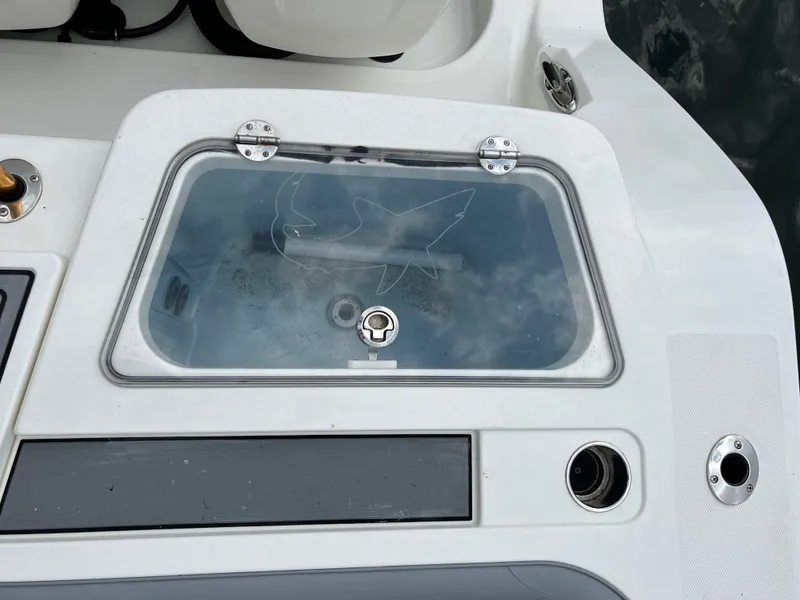 Slide: The Image of Livewell on 2017 Mako 414 CC Bluewater Family Edition boat, featuring a shark design. - 6