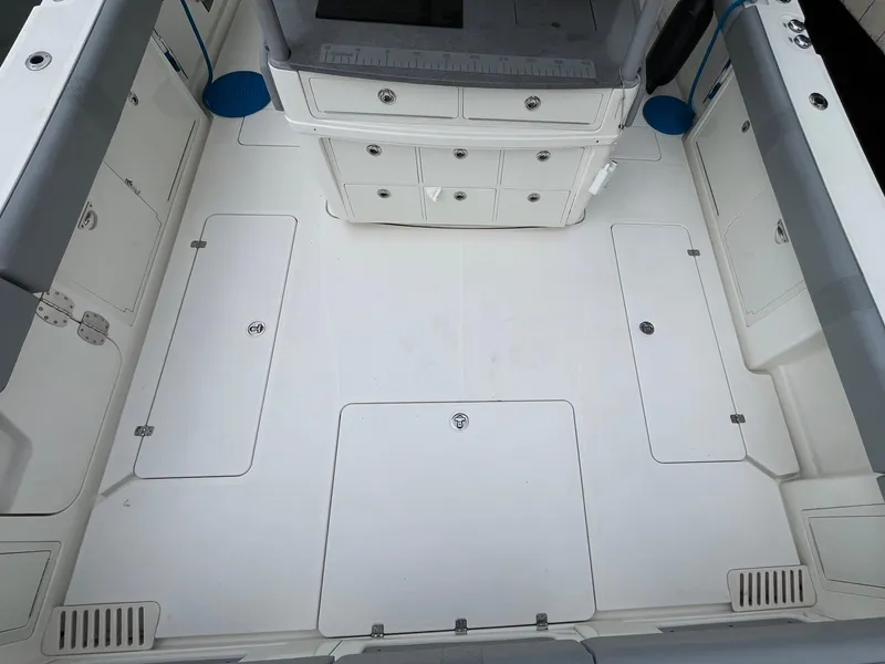 Slide: The Image of 2017 Mako 414 CC Bluewater Family Edition boat deck with storage compartments. - 7