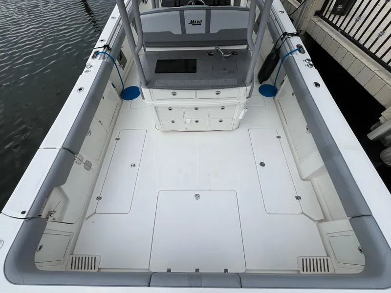 Slide: The Image of 2017 Mako 414 CC Bluewater Family Edition boat interior, featuring spacious deck and storage compartments. - 8