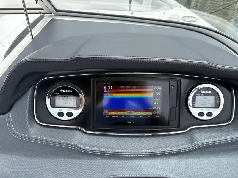 Slide: The Image of Dashboard of 2020 Chaparral 250 Suncoast with Garmin display and Yamaha gauges. - 19