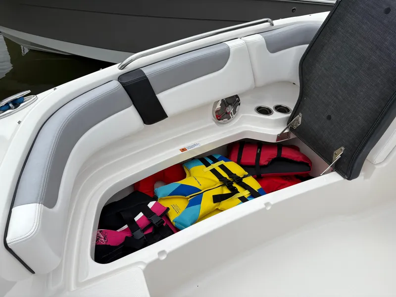 Slide: The Image of 2020 Chaparral 250 Suncoast boat storage with colorful life jackets. - 29