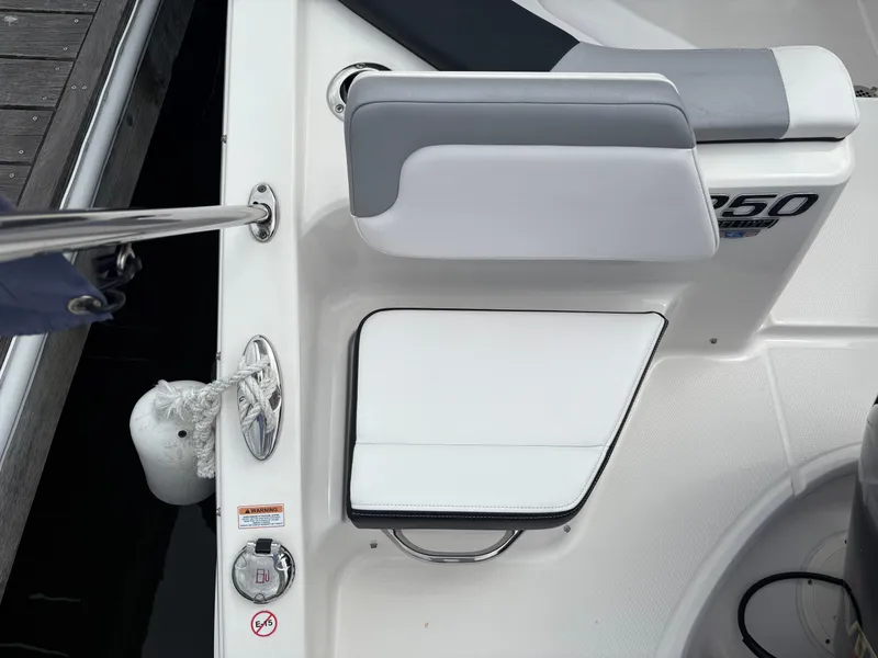 Slide: The Image of 2020 Chaparral 250 Suncoast boat interior with seating and dock details. - 7