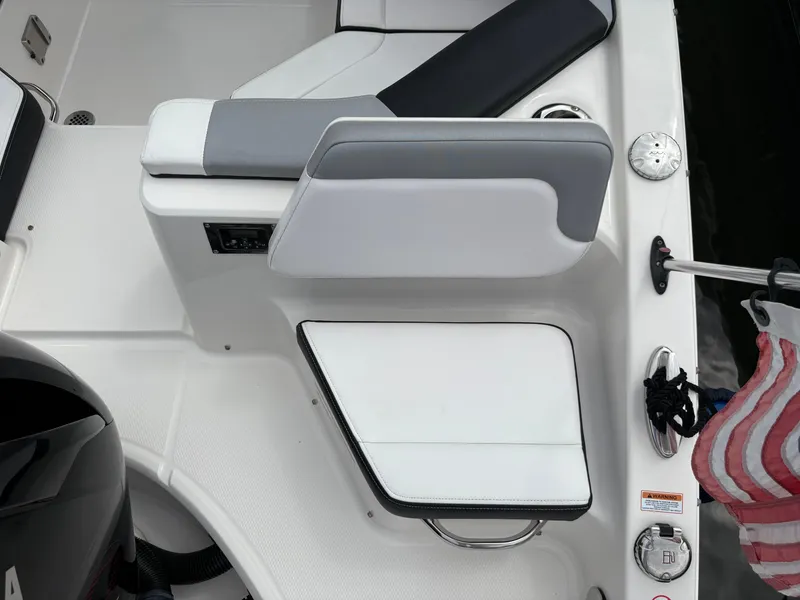 Slide: The Image of 2020 Chaparral 250 Suncoast boat seating area with modern design and accessories. - 8