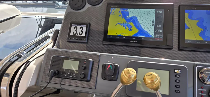 Slide: The Image of Dashboard of a 2004 Tiara Yachts 5200 Sovran with navigation equipment. - 13