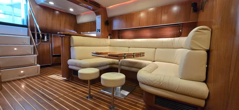 Slide: The Image of Luxurious interior of 2004 Tiara Yachts 5200 Sovran with plush seating and elegant wood finishes. - 18