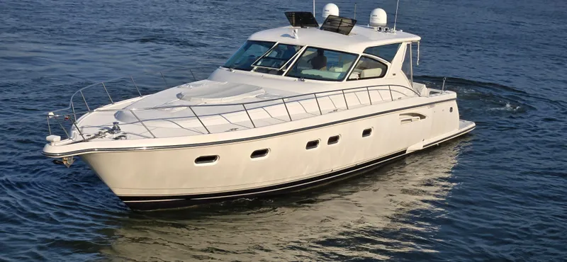 Slide: The Image of 2004 Tiara Yachts 5200 Sovran cruising on open water. - 2