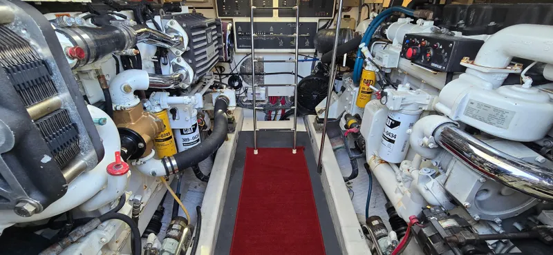 Slide: The Image of Engine room of 2004 Tiara Yachts 5200 Sovran with dual engines and red carpet. - 26