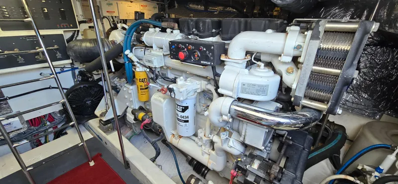 Slide: The Image of Engine room of a 2004 Tiara Yachts 5200 Sovran, showcasing detailed machinery and components. - 28