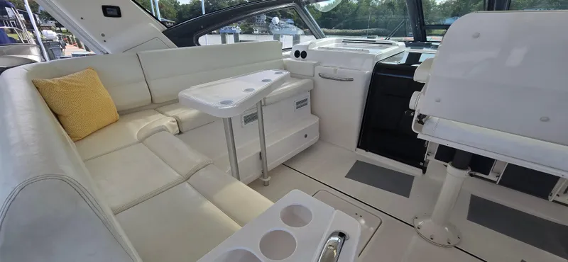 Slide: The Image of Interior of 2004 Tiara Yachts 5200 Sovran with white seating and table. - 4