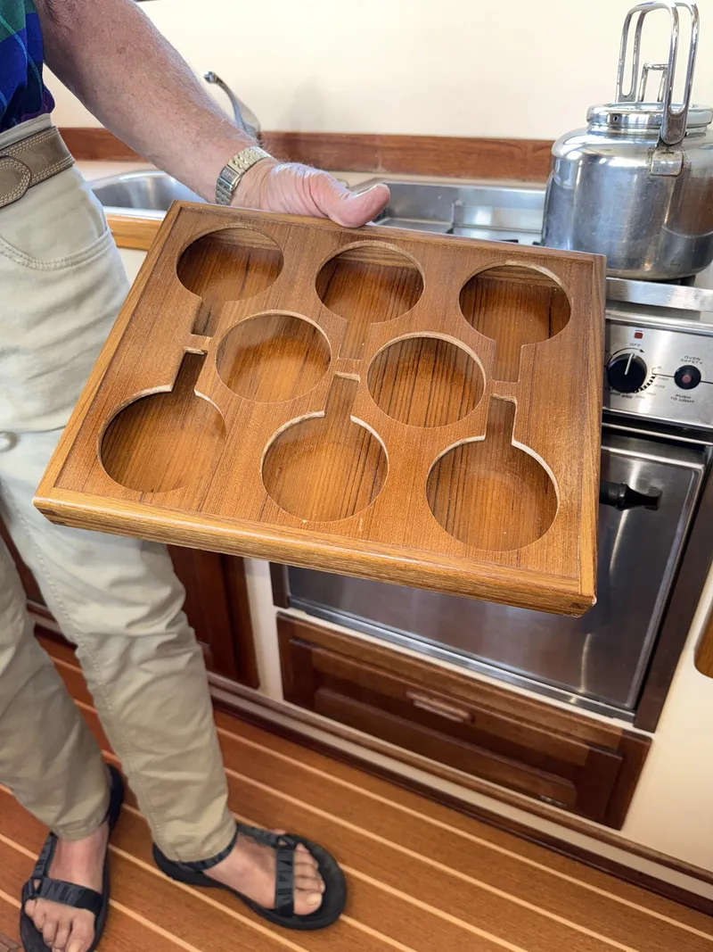 Slide: The Image of Wooden cup holder in a 1997 Nordic Tug 26 kitchen, near stove and sink. - 20