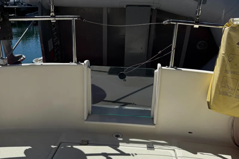 Slide: The Image of 1997 Nordic Tug 26 boat deck with railing and safety equipment. - 4