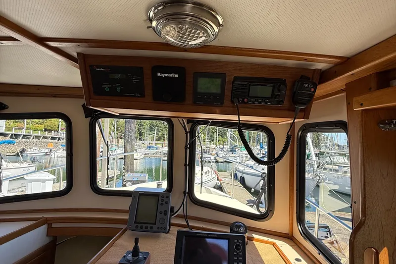 Slide: The Image of Interior view of a 1997 Nordic Tug 26 boat with navigation equipment. - 9