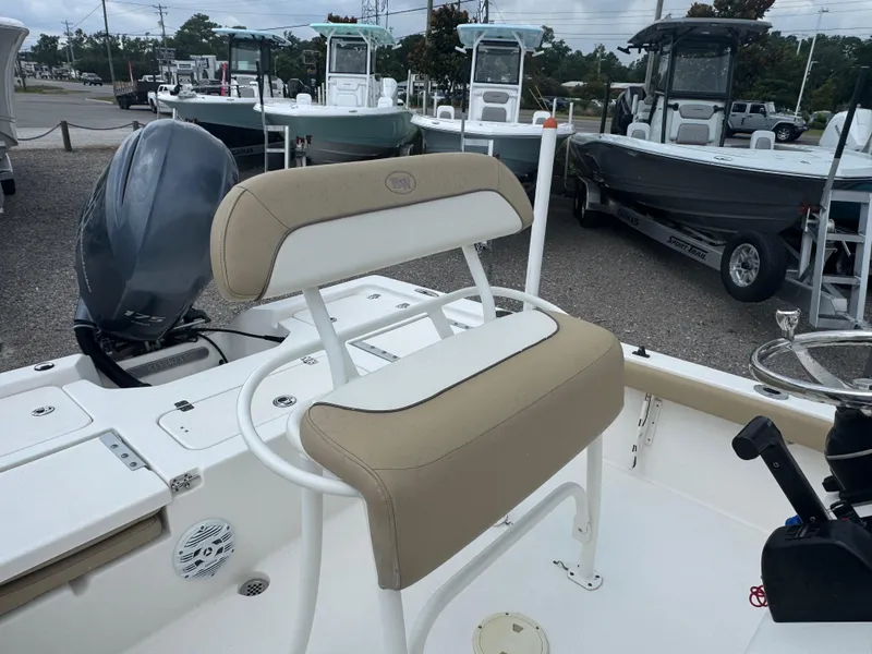 Slide: The Image of 2016 Key West 210BR boat with beige seating and Yamaha outboard motor. - 7