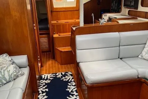Slide: The Image of Interior of a 2003 Caliber 40LRC yacht with wood finish and gray seating. - 16