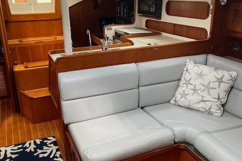 Slide: The Image of Interior of 2003 Caliber 40LRC yacht with cozy seating and nautical decor. - 18