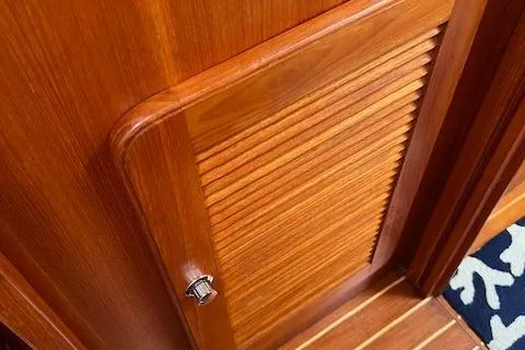 Slide: The Image of Wooden cabinet door on 2003 Caliber 40LRC yacht interior. - 29