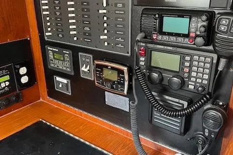 Slide: The Image of Control panel of a 2003 Caliber 40LRC boat with communication equipment and switches. - 31