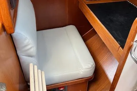 Slide: The Image of 2003 Caliber 40LRC interior with cushioned seating and wooden desk. - 33