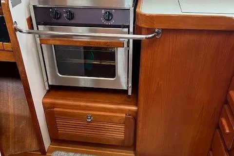 Slide: The Image of Wooden kitchen interior with built-in oven on a 2003 Caliber 40LRC yacht. - 34