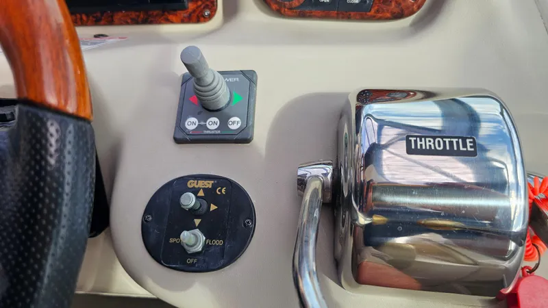 Slide: The Image of Control panel of 2007 Sea Ray 340 Sundancer with throttle and switches. - 11