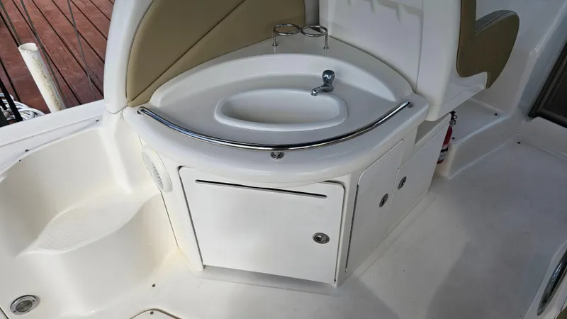 Slide: The Image of 2007 Sea Ray 340 Sundancer boat sink and storage area. - 18