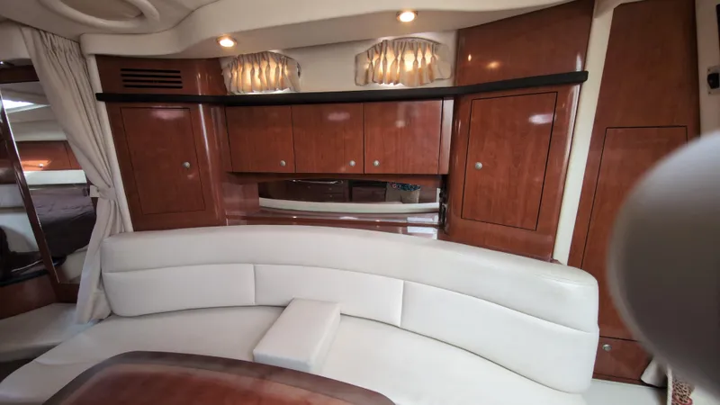 Slide: The Image of Luxurious interior of 2007 Sea Ray 340 Sundancer with elegant wood cabinetry and plush seating. - 24