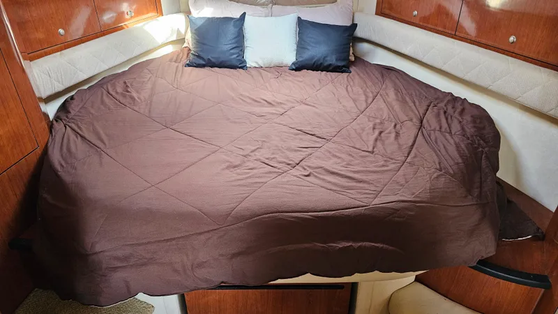 Slide: The Image of Luxurious cabin interior of 2007 Sea Ray 340 Sundancer with cozy bedding. - 30