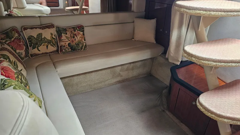 Slide: The Image of Interior of 2007 Sea Ray 340 Sundancer with beige seating and floral cushions. - 31