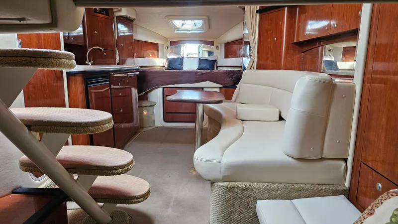 Slide: The Image of Luxurious 2007 Sea Ray 340 Sundancer interior with elegant seating and wood finishes. - 33