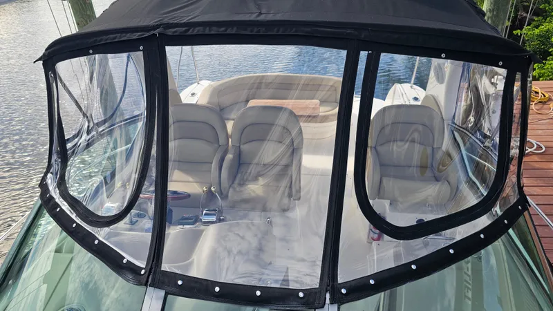 Slide: The Image of 2007 Sea Ray 340 Sundancer boat with covered cockpit and seating area. - 41