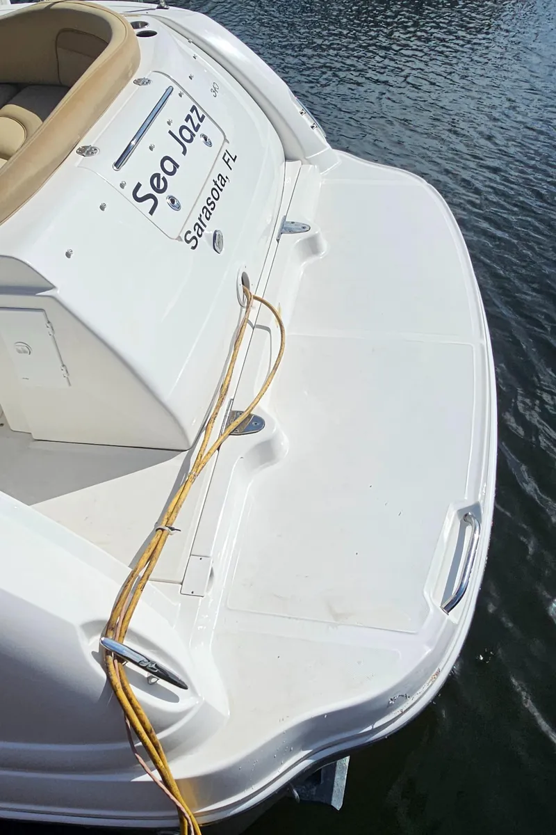 Slide: The Image of 2007 Sea Ray 340 Sundancer boat docked, featuring "Sea Jazz" nameplate, Sarasota, FL. - 43