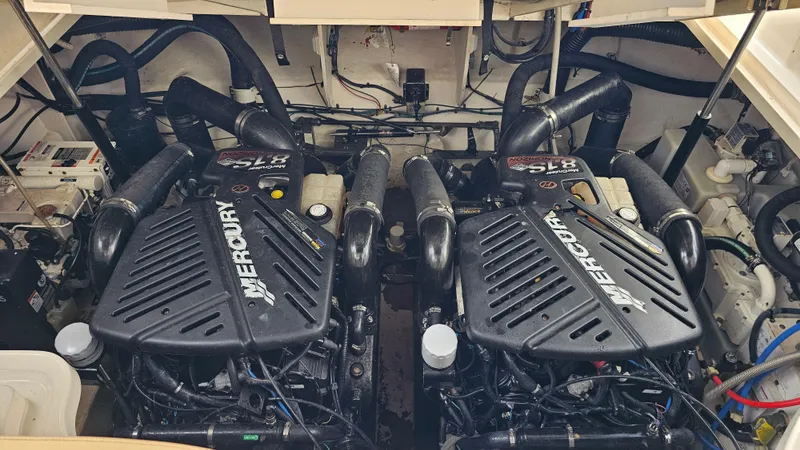 Slide: The Image of Engine room of 2007 Sea Ray 340 Sundancer with twin Mercury engines. - 44