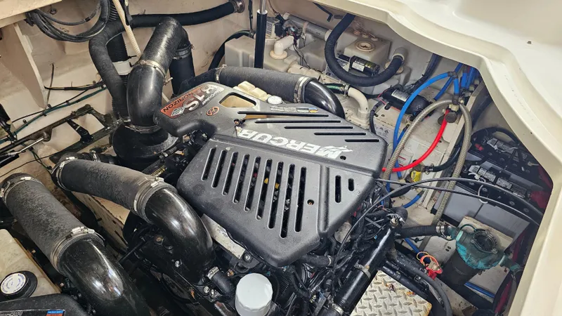 Slide: The Image of Engine compartment of 2007 Sea Ray 340 Sundancer with MerCruiser engine and visible wiring. - 46