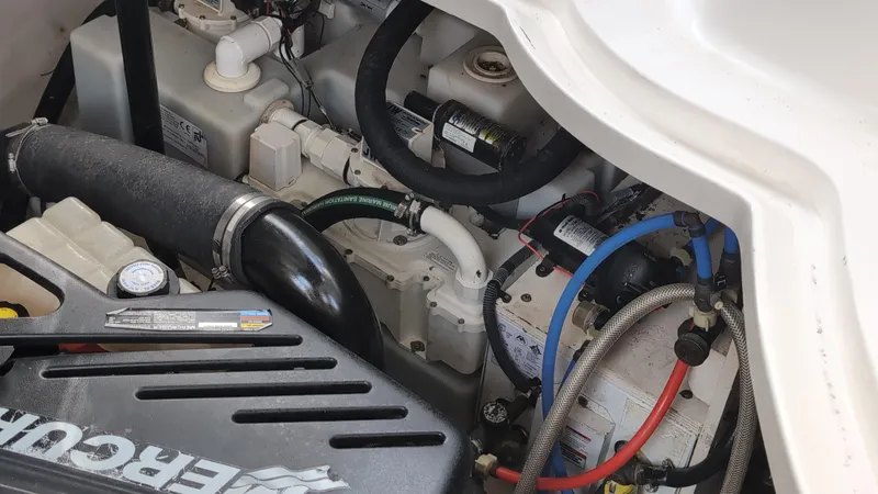 Slide: The Image of Engine compartment of a 2007 Sea Ray 340 Sundancer boat, showing hoses and components. - 47
