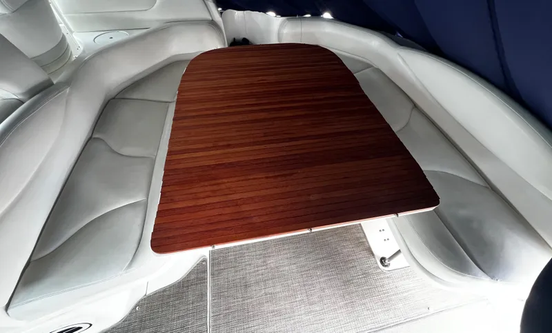 Slide: The Image of Luxurious interior of 2000 Sea Ray 380 Sundancer with elegant wooden table. - 16