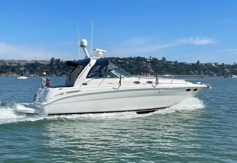 Slide: The Image of 2000 Sea Ray 380 Sundancer cruising on a sunny day in calm waters. - 2