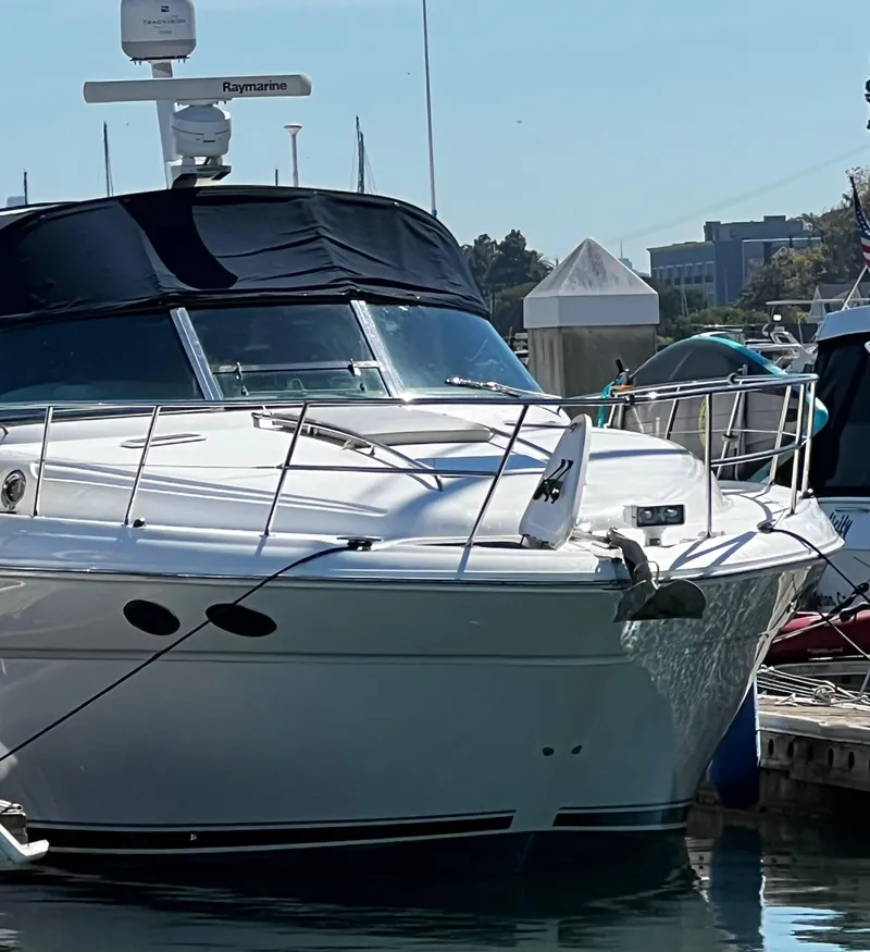 Slide: The Image of 2000 Sea Ray 380 Sundancer yacht docked at marina, front view. - 6