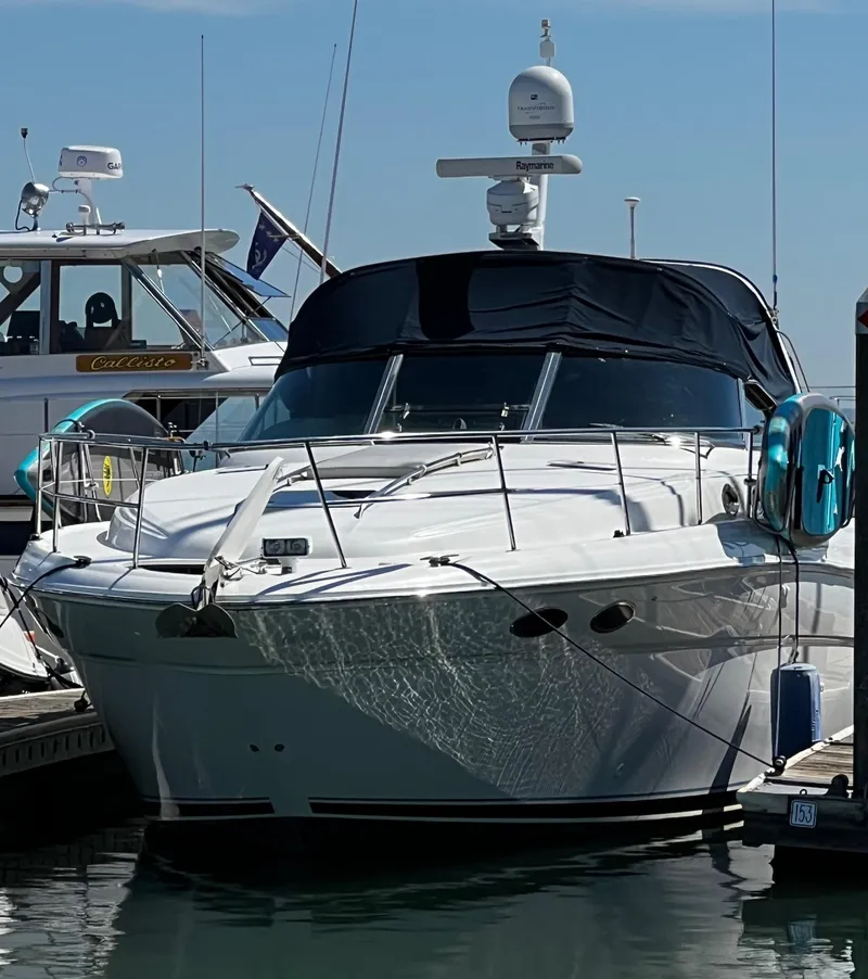 Slide: The Image of 2000 Sea Ray 380 Sundancer yacht docked at marina, front view. - 8