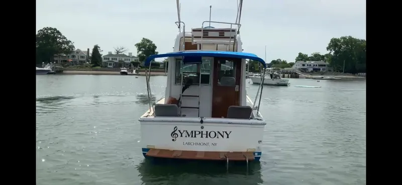 Slide: The Image of 1986 Cape Dory 26 Fly boat named "Symphony" on calm water in Larchmont, NY. - 4