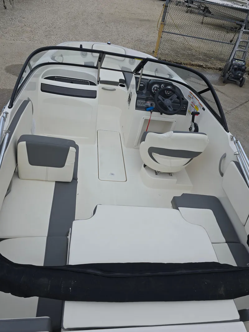 Slide: The Image of 2018 Bayliner VR4 Bowrider I/O interior with seating and steering console. - 12