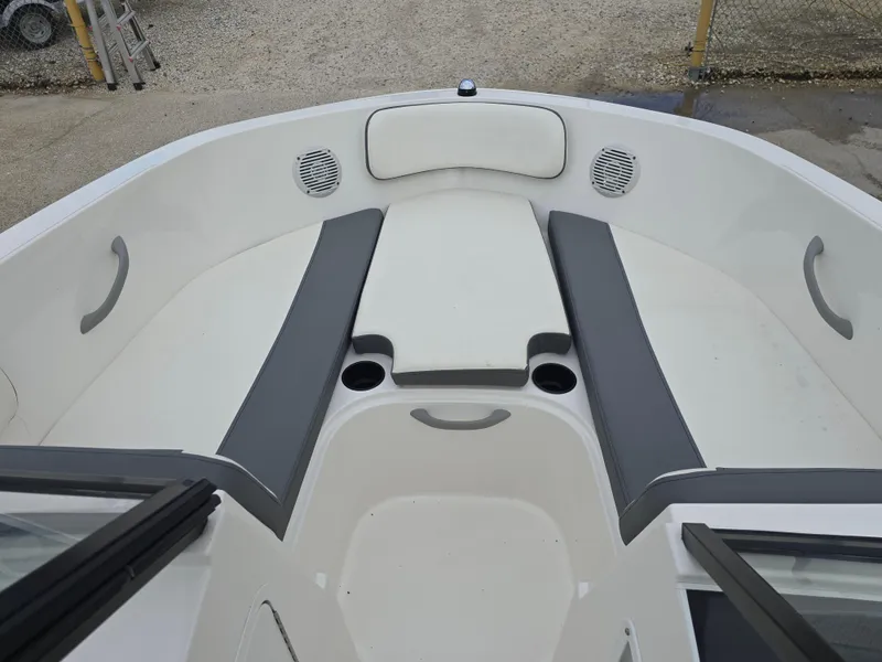Slide: The Image of 2018 Bayliner VR4 Bowrider I/O interior with gray seating and cup holders. - 13