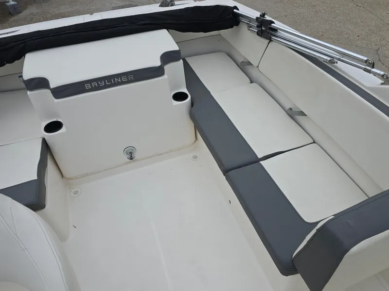 Slide: The Image of 2018 Bayliner VR4 Bowrider I/O interior with white and gray seating. - 14